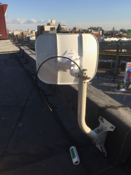 Figure 4: Ubiquiti LiteBeam AC mounted on a roof edge.